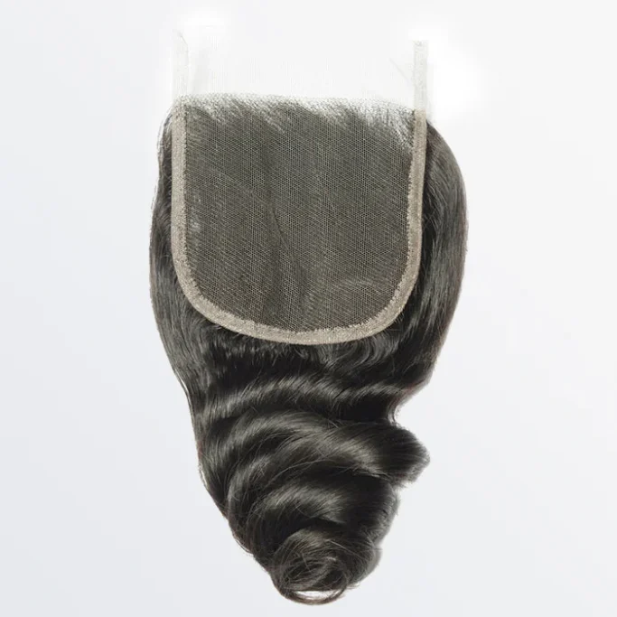 Ocean Wave Closure Curly black hairpiece with a lace front for natural appearance.